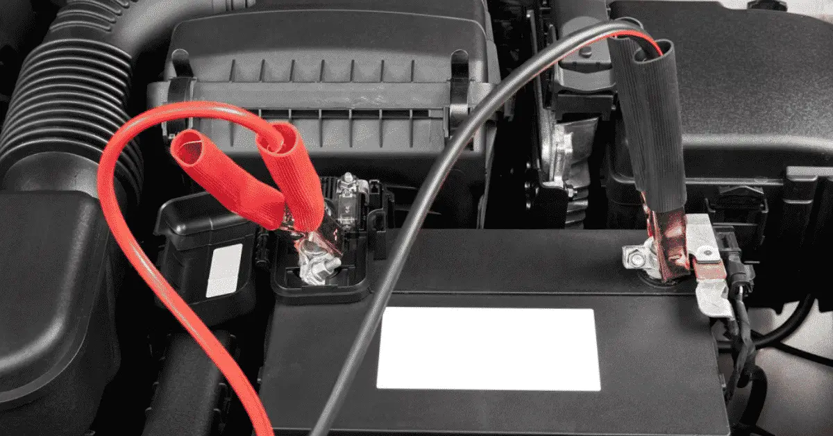 jumper cables connected in the correct order to jump start a car battery