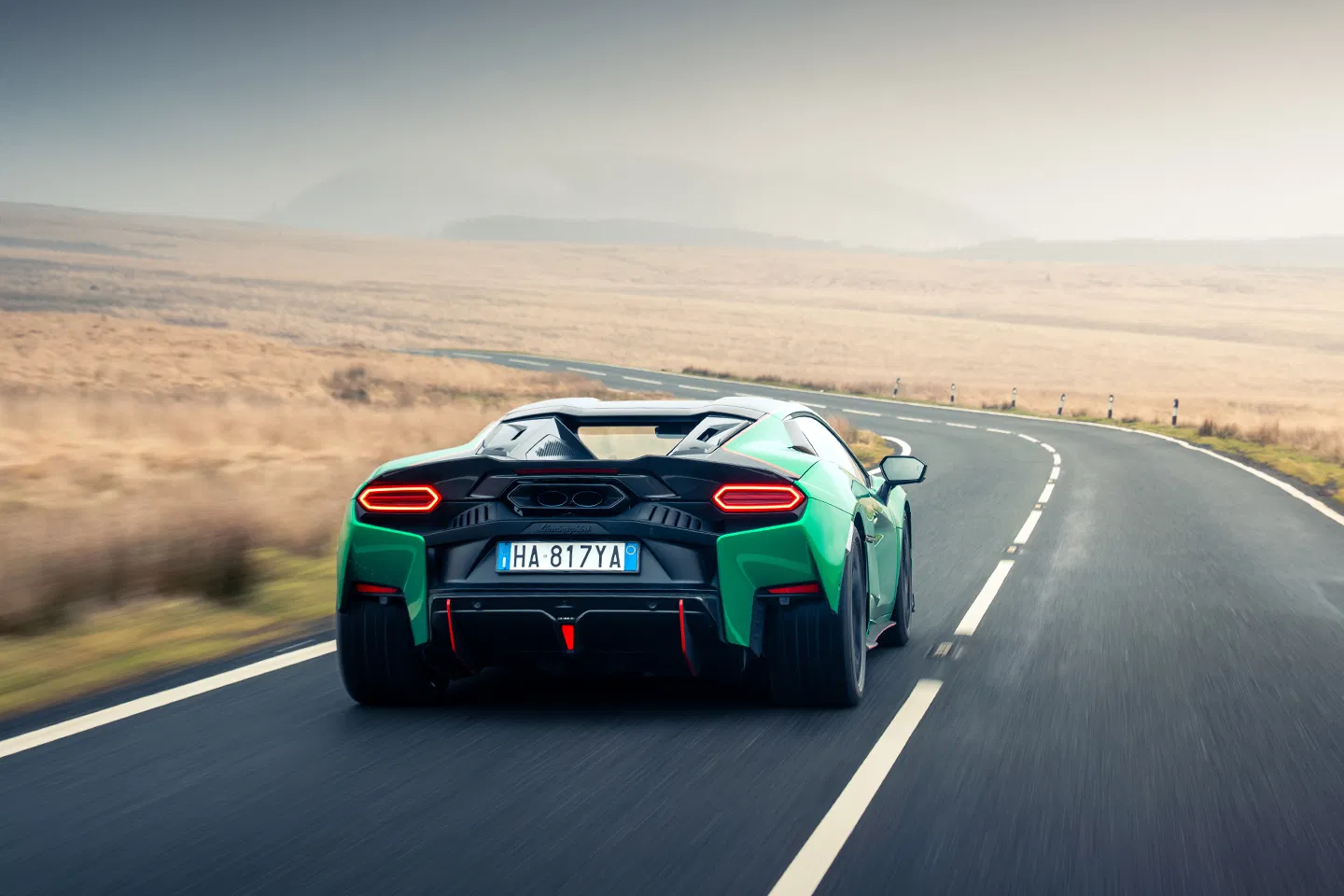 Lamborghini Temerario: Hybrid Power Meets Supercar Drama 3 Green supercar on winding road