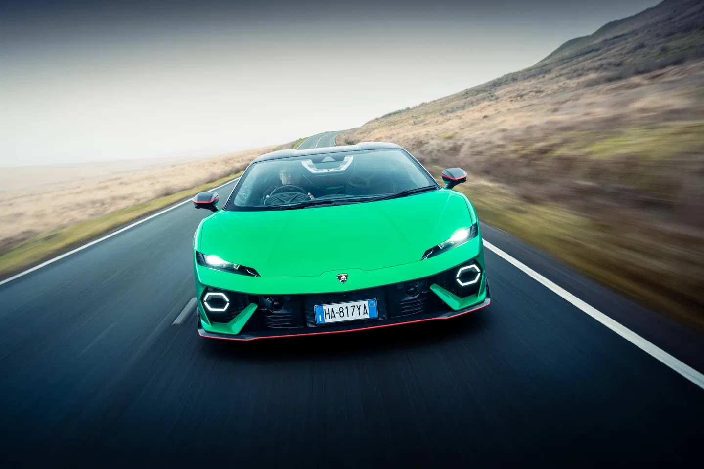 Lamborghini Temerario: Hybrid Power Meets Supercar Drama 2 Vibrant green Lamborghini on winding road